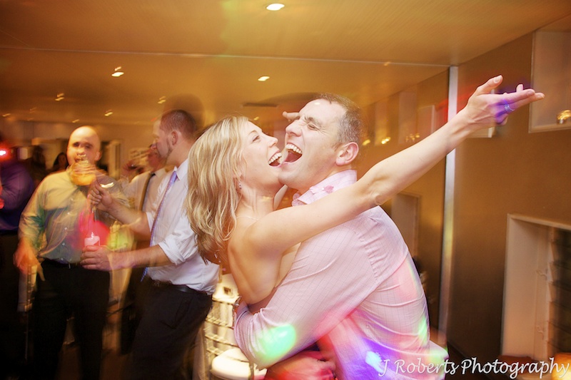 Couple singing while on the dance floor -wedding photography sydney